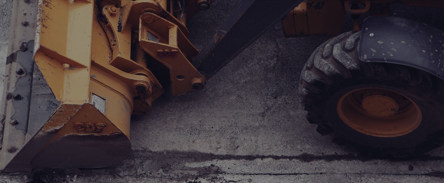 A wheel loader clearing a demolition site
